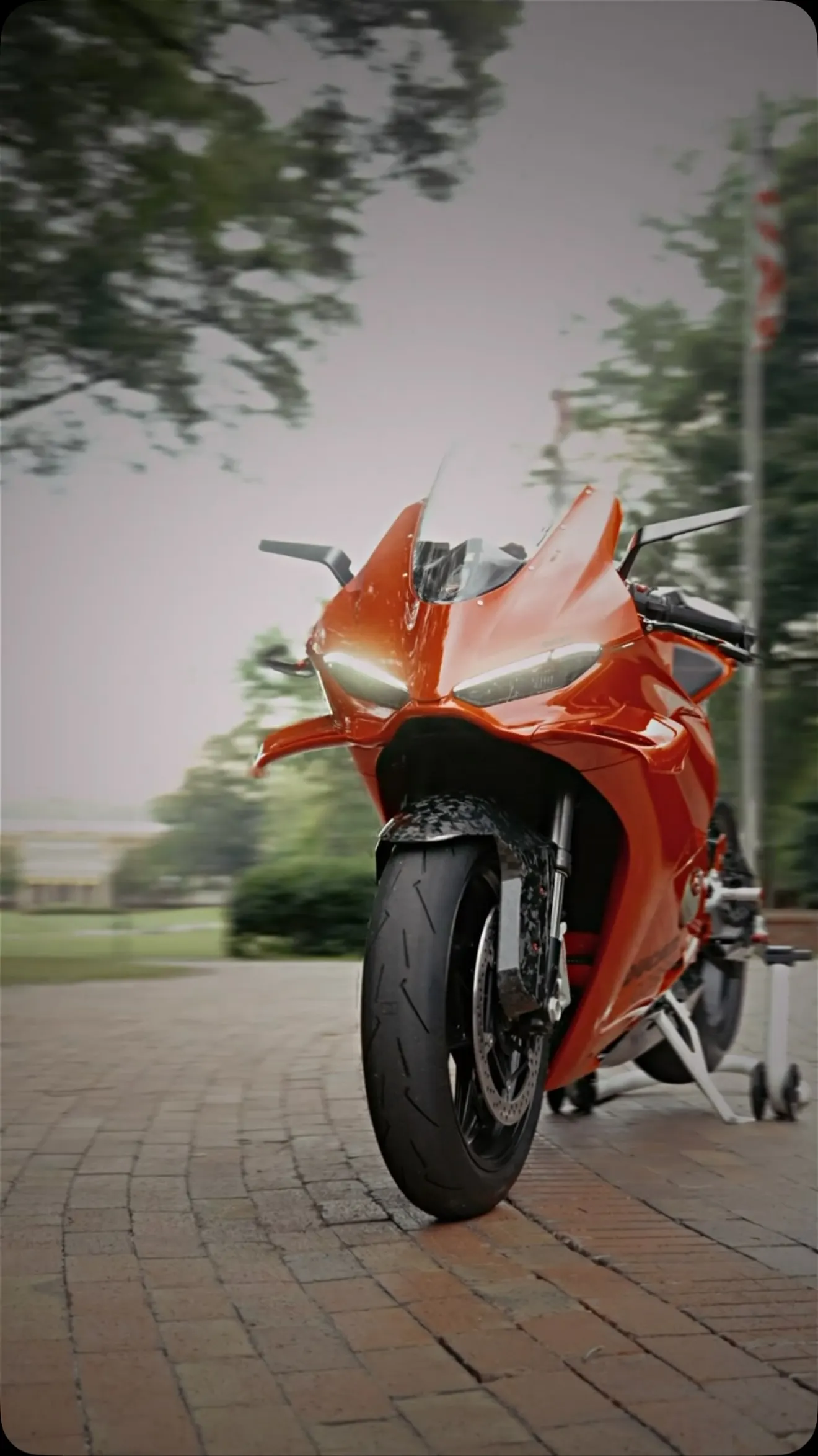 Red Panigale V4 on a brick drive