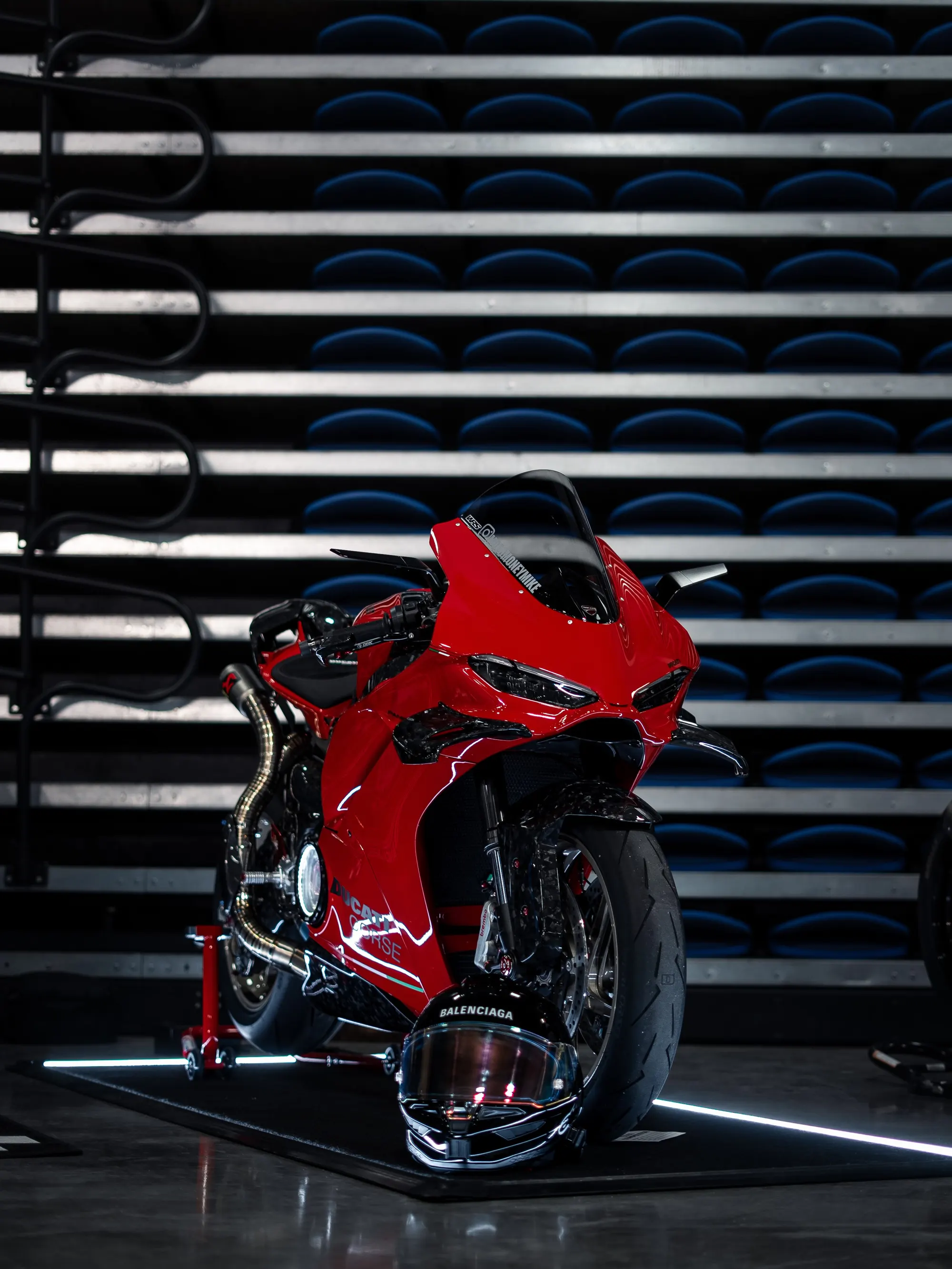 Mike's red Ducati Panigale V4 under track lighting